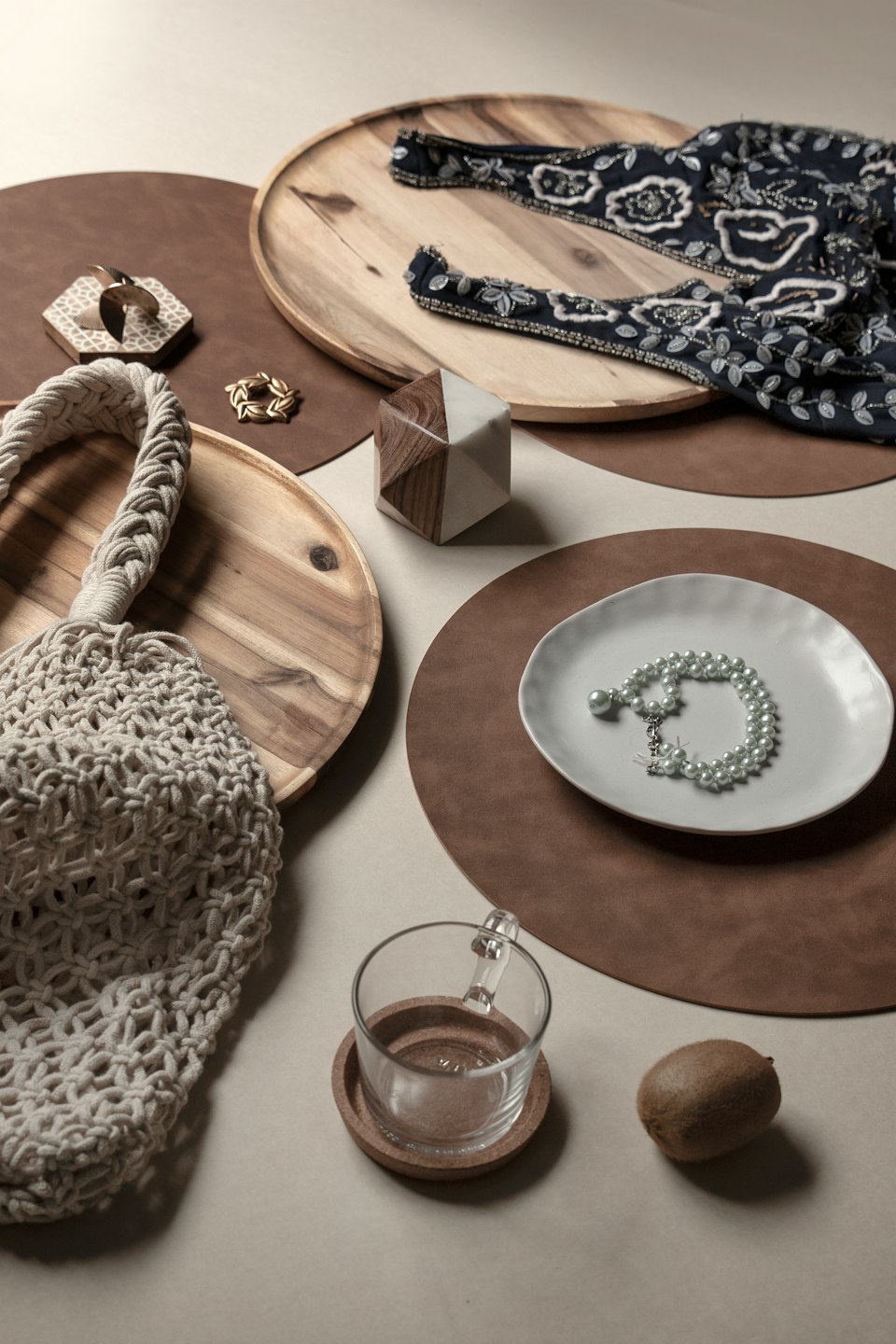 Home decor and fashion accessories arranged on a flat surface.